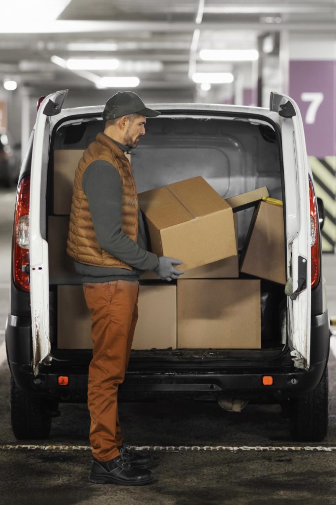 side-view-man-loading-car-with-packages